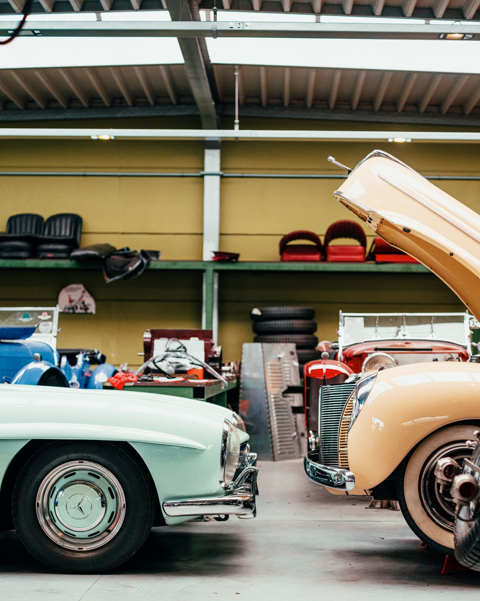 Wide multi-bay collector garage with a polished concrete floor — the scale a Weston 3-car plan covers